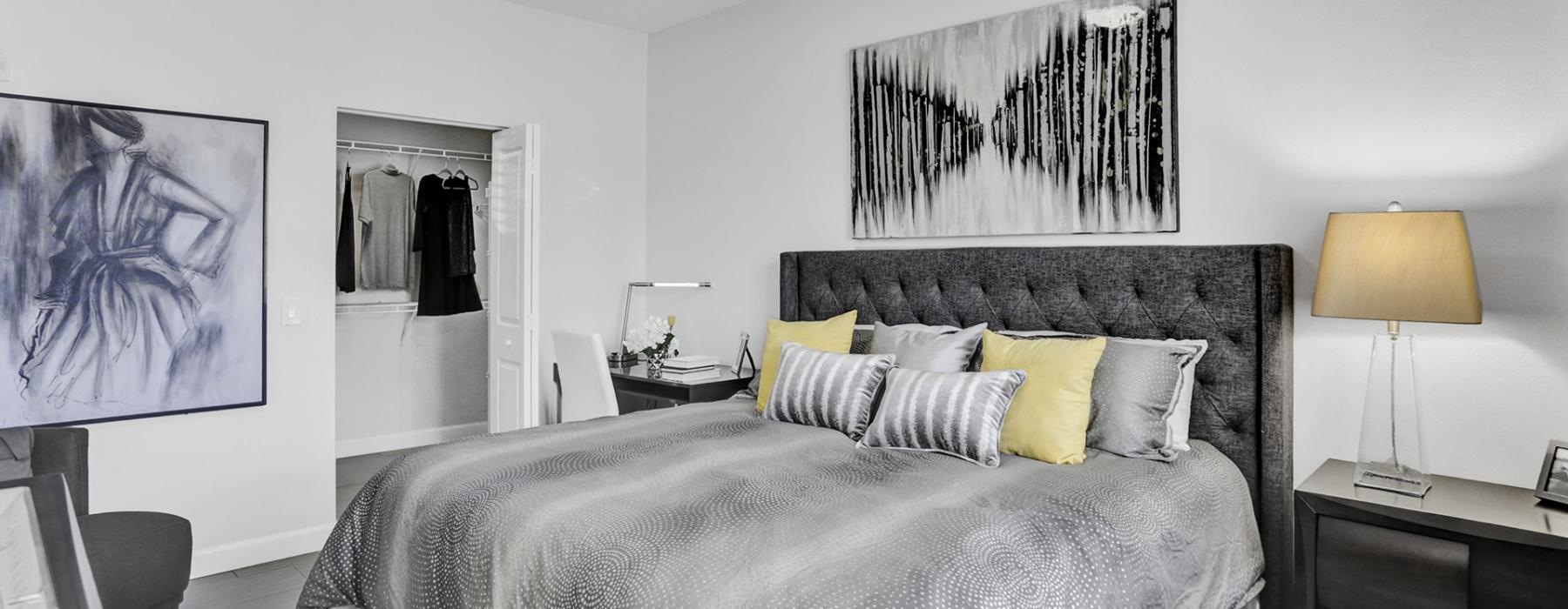 a bedroom with a bed and a lamp