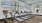 a room with a large treadmill and a large window
