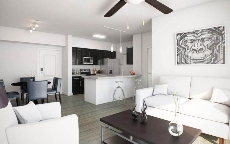 a living room with a white couch and a table